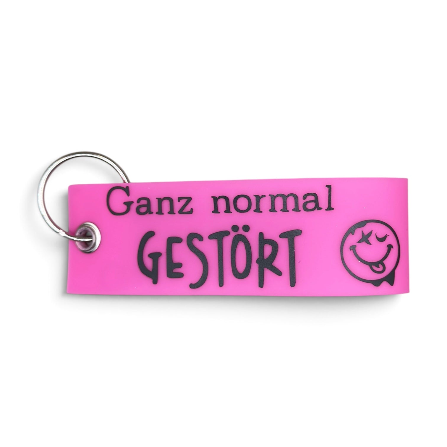 Pinker Vinyl-Schlüsselanhänger mit Aufschrift „Ganz normal gestört“ und Smiley
